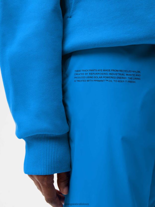 Recyklované nylonové tepláky ženy NXTFX6364 blankytná modrá Pangaia oblečenie